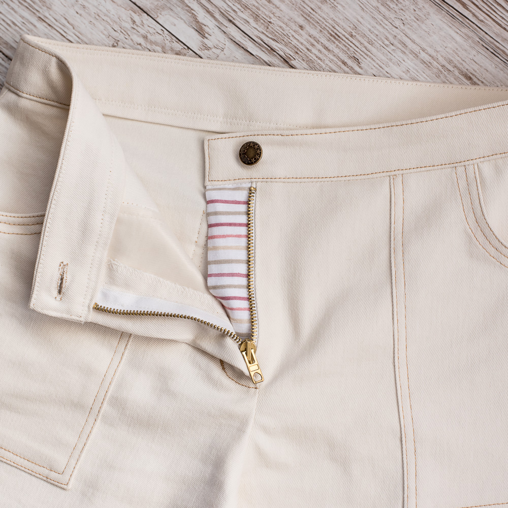 Cream Wide-leg Denim Trousers
Fly front detail