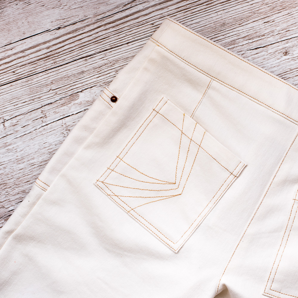 Cream Wide-leg Denim Trousers
Back pocket detail
