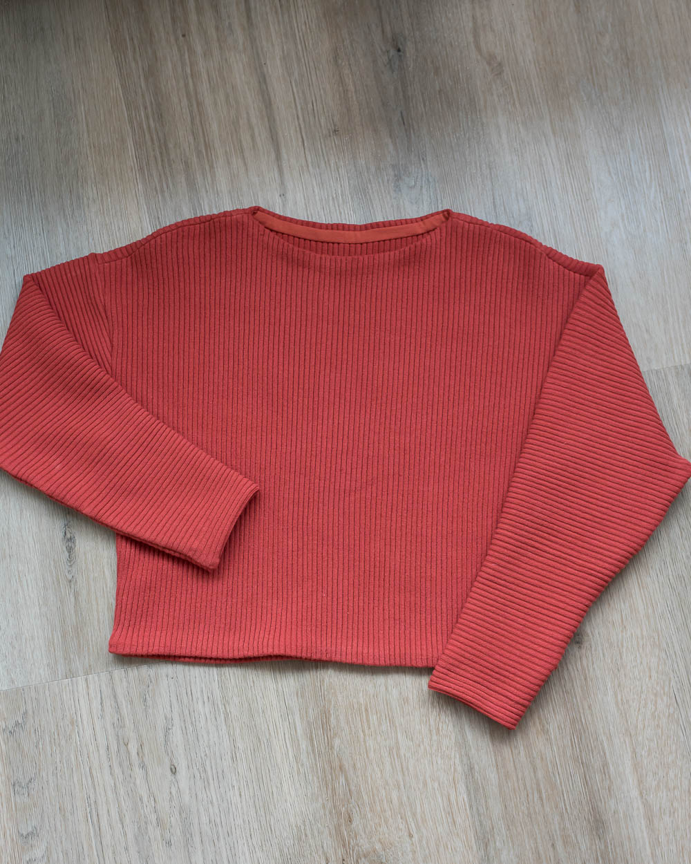 Summer sweater showing bateaus neck hem detail